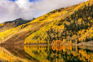 Crystal Lake, located on Red Mountain Pass, above Ouray, Colorado, provides some of the best reflections of the surrounding colors that can be had in Colorado.