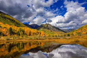 Several ponds within the the town of Rico, Colorado provide beautiful reflections for the surrounding mountains in early October.