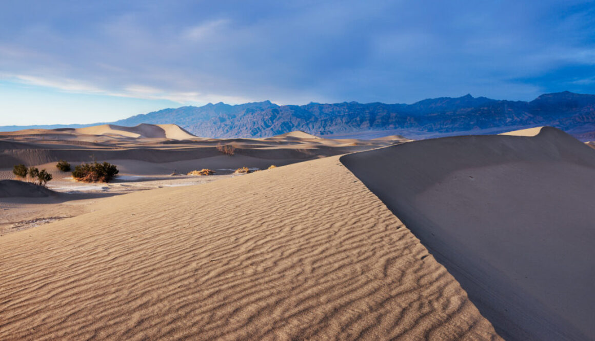 A beautiful sunset sweeping across the face of the Mesquite Sand Dunes in Death Valley National Park.