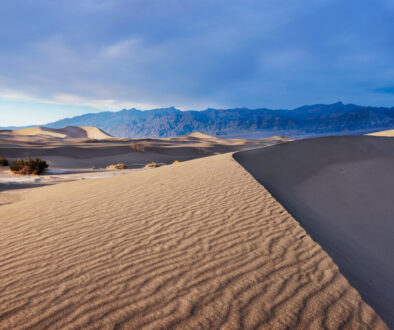 A beautiful sunset sweeping across the face of the Mesquite Sand Dunes in Death Valley National Park.