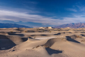 Shadows form over the Mesquite Dunes as the sun sets.