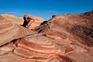 The Fire Wave, in the Valley of Fire State Park, can be found just off Mouses's Tank Road. A trailhead leads about a half mile to these colorful patterns and rocks.