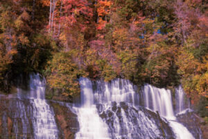 Beautiful colors highlight a large flowing waterfall, at Twin Falls, Rock Island State Park