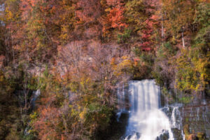 Water cascades down the waterfall in Rock Island State Park, Tennessee