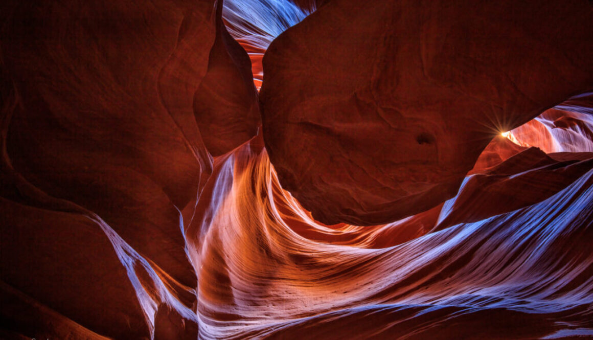 Inside the canyon, light swirls down through the opening above to create a wonderland of color.