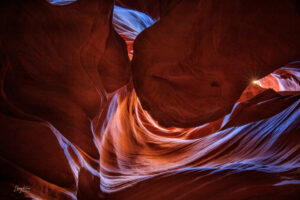 Inside the canyon, light swirls down through the opening above to create a wonderland of color.